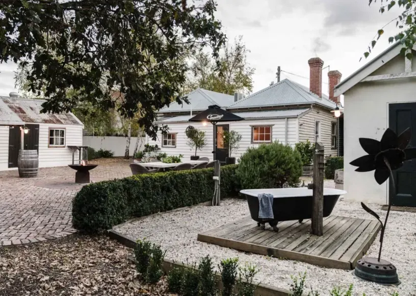 Bootmakers Cottage and its courtyard in Birregurra, Victoria