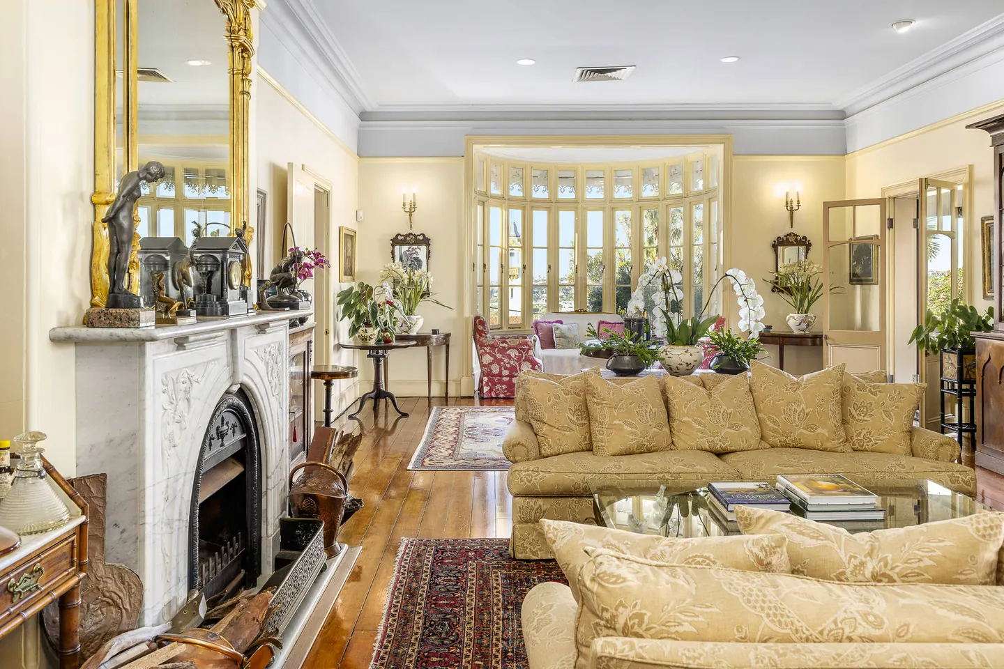 Ornate fireplace and decorative ceiling in a period residence in Bowen Hills